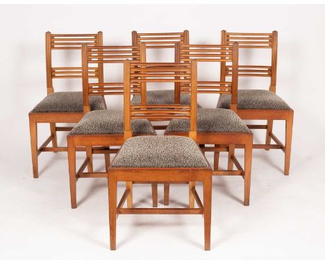 A set of six William Tillman mahogany dining chairs, each with reeded uprights and fluted bar backs, the drop-in seats uphols