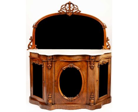 A Victorian walnut credenza, the arched mirror back above a marble top, the base enclosed by three mirror panelled doors, 136