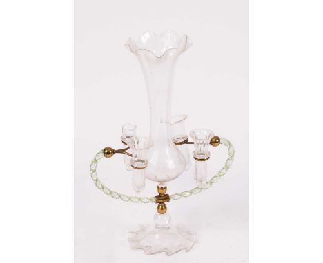 An English glass epergne the central vase with flared rim, on a gilt metal short stem supportimg wrythen arms, with four smal