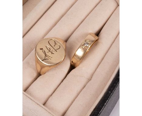 An 18ct gold wedding band, CAH, Birmingham, set with a small diamond, approximately 6.2g and a 9ct gold signet ring, initiall