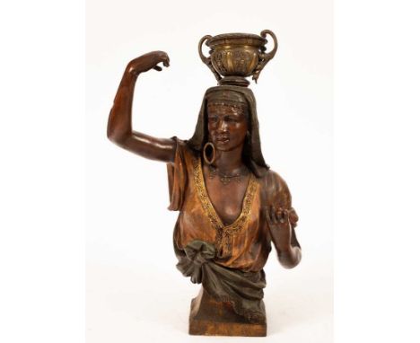 A bronzed torso of an Egyptian dancer, with headdress, gilded blouse and a tied green sash on a rectangular socle, 66cm highL