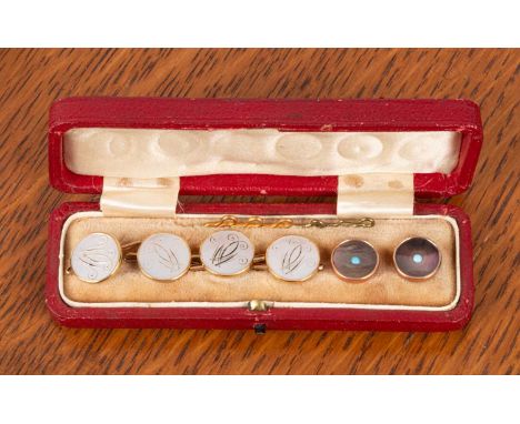 A set of four 18ct gold and mother-of-pearl dress studs and two other dress studs, in a fitted boxOverall good condition, wea