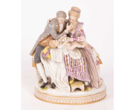 A Ludwigsburg porcelain figure group of a couple holding a baby, a child behind with a pipe, marked to base, 19cm high