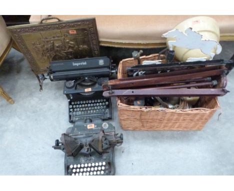 A basket of metalware and sundries, two typewriters and a brass firescreen