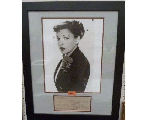 JUDY GARLAND 1922-1969 A rare framed photograph and signed cheque. Prov: Sid Luft from The Judy Garland Collection