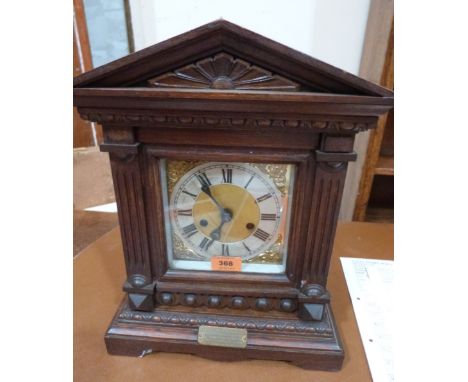 An early 20th century oak mantle clock in architectural case. 16' high