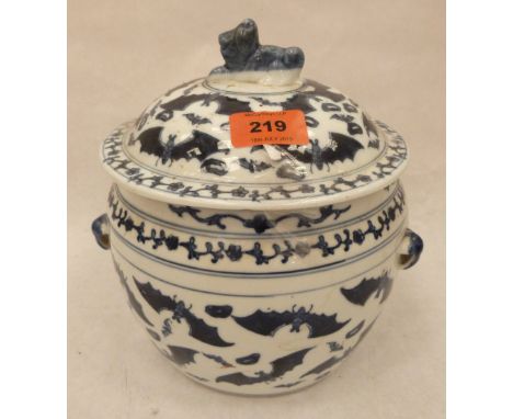 A Chinese blue and white jar and cover with bat and foliate decoration, the cover with dog finial. 8½' high