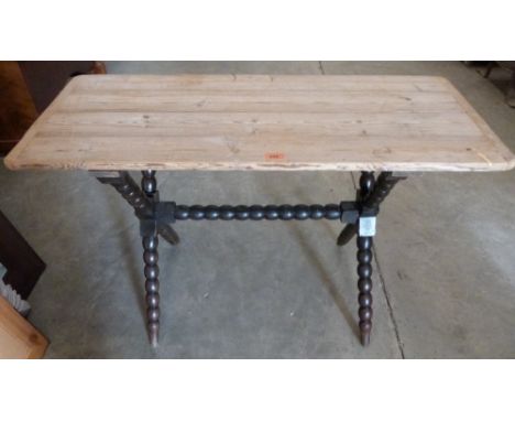 A pine side table on X framed bobbin turned support. 41' wide