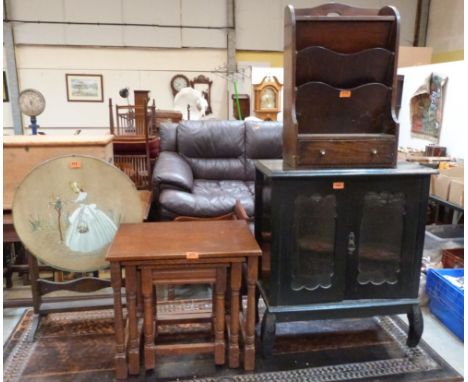 A glazed cupboard, stationary rack, oak nest of tables and a firescreen