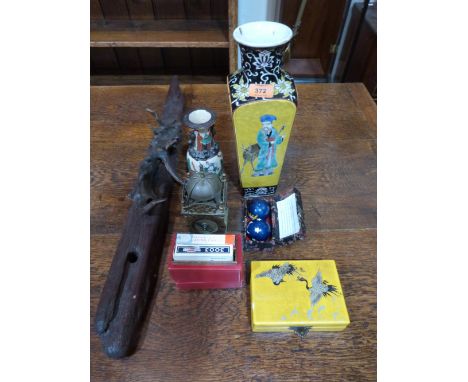 A Chinese vase, wood carving, brass clock and other objects