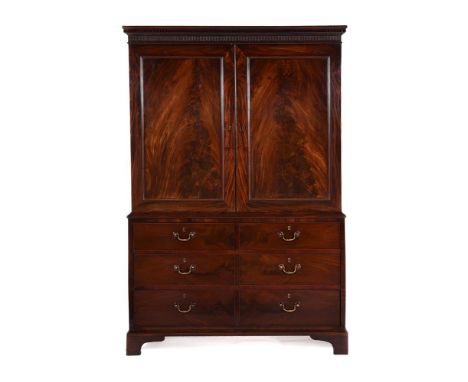A GEORGE III FIGURED MAHOGANY CLOTHES PRESSIN THE MANNER OF THOMAS CHIPPENDALE, CIRCA 1780184.5cm high, 125.cm wide, 57cm dee