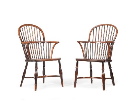 A PAIR OF YEW AND ELM STICK BACK WINDSOR ARMCHAIRSEARLY 19TH CENTURYWith crinoline stretcherseach 98cm high, 58cm wide, 54cm 