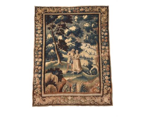 A VERDURE TAPESTRY PANEL 18TH CENTURY Depicting a young courting couple in a landscape 283cm high, 184cm wide Condition Repor