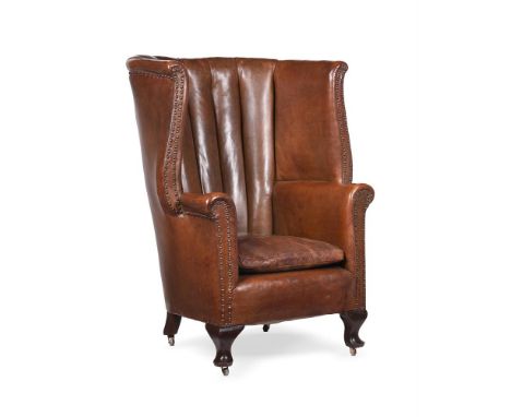 A LEATHER UPHOLSTERED WING ARMCHAIREARLY 20TH CENTURY107cm high, 83cm wide, 81cm deep overallCondition Report: There are some