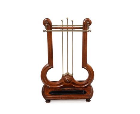 AN EARLY VICTORIAN OAK AND BRASS STICK STANDCIRCA 1840Of lyre form 86cm high, 56cm wide, 35cm deepCondition Report: There are