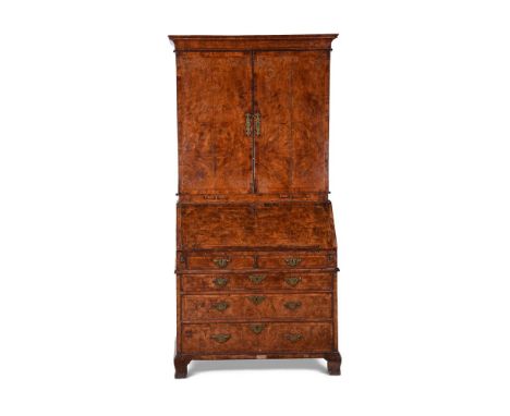 A GEORGE I BURR WALNUT BUREAU CABINETBY WILLIAM OLD AND JOHN ODY, CIRCA 1725Cross and feather banded, the doors enclosing adj