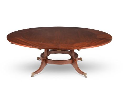 A MAHOGANY CIRCULAR CONCENTRIC EXTENDING DINING TABLEBY ARTHUR BRETT, PROBABLY LAST QUARTER 20TH CENTURY71cm high, the top 15