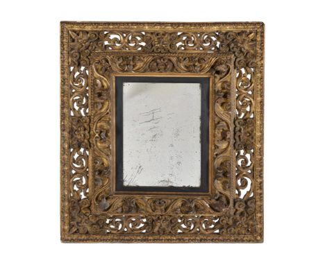 A LARGE CONTINENTAL CARVED GILTWOOD WALL MIRROR SECOND HALF 18TH CENTURY 115cm high, 125cm wideThe internal measurements of t