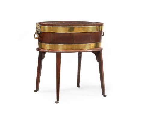 A GEORGE III MAHOGANY AND BRASS BOUND WINE COOLER IN THE MANNER OF THOMAS CHIPPENDALE, CIRCA 1780 Of coopered formON AN ASSOC