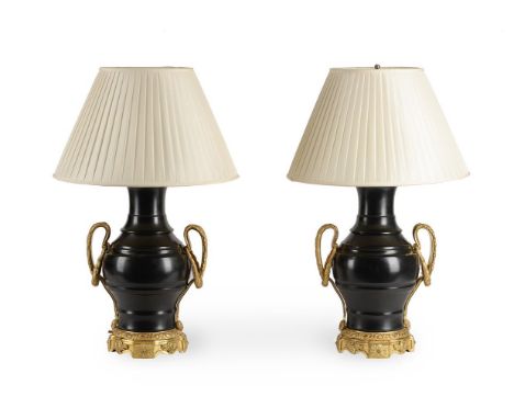 A PAIR OF GILT METAL MOUNTED BLACK MARBLE URNSIN LOUIS XVI STYLEeach 45cm high overallProvenance:An Important Collection from