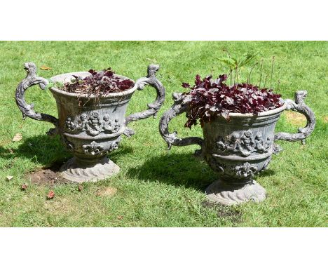 A PAIR OF LEAD TWIN HANDLED URNS   20TH CENTURY 17th century style mythological creature handles and applied cherub and folia
