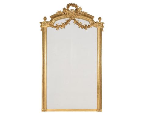 A LARGE CARVED GILTWOOD WALL MIRRORIN LOUIS XVI STYLE, SECOND HALF 19TH CENTURY232cm high, 132cm wideProvenance:  Ston Easton