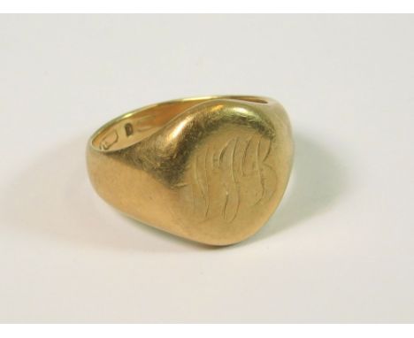 SIGNET RING. A gentleman's 9ct. gold signet ring, monogrammed. Size. J/K. Approx. 7.9g.