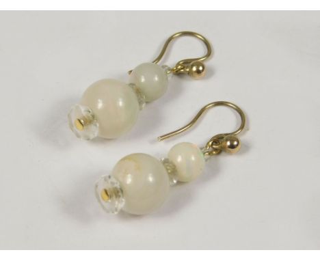 OPAL EARRINGS. A pair of opal &amp; crystal pendant earrings on 9ct. gold hand made hooks.