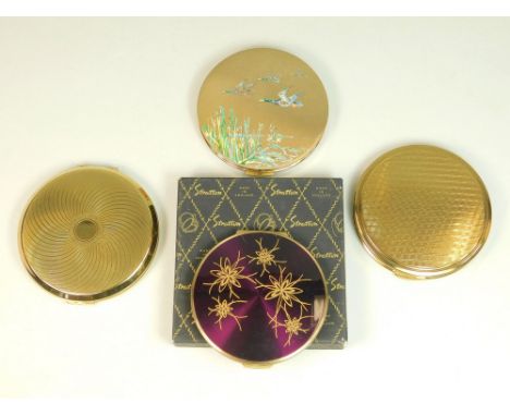 POWDER COMPACTS. Three vintage Stratton powder compacts, one with original box. Also, one other gold tone powder compact.