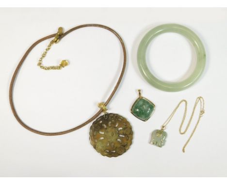 JADE. A Russian jade pendant with 9ct. gold hinged bale, a jade elephant pendant mounted in 9ct. gold &amp; with a 9ct. gold 