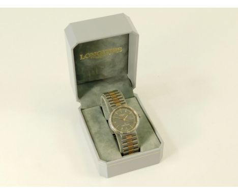 LONGINES. A gentleman's Longines Conquest Titanium wristwatch, the dial with baton numerals, sweep seconds hand & date apertu