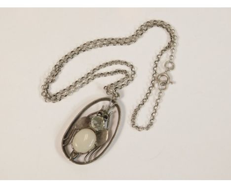 SILVER PENDANT. A hand made silver pendant, at the centre a fly set a white opal & a pale blue cut stone. Length of drop 4cm.