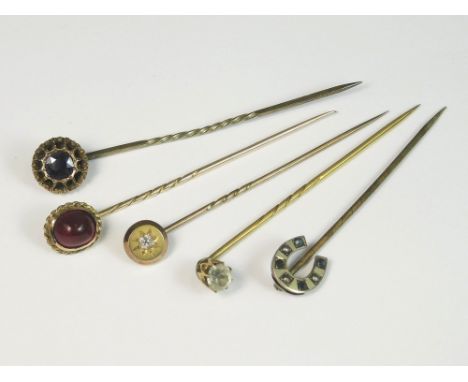 STICK PINS. Five various late 19th/early 20th century stick pins.