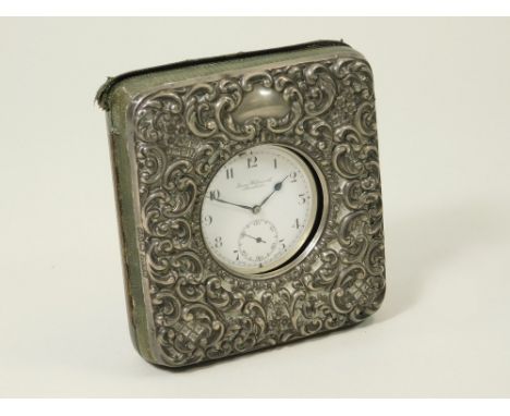 TRAVELLING WATCH. A 1920s, open faced, keyless pocket watch retailed by James Wadsworth, Manchester. Fitted in silver mounted