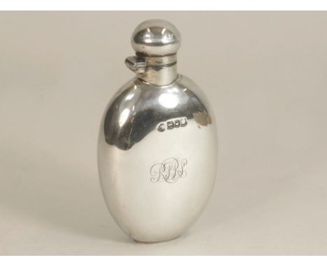 SILVER FLASK. An Edwardian silver spirit flask by W. Hutton &amp; Sons, the front monogrammed. Height 12cm. Approx. 104g (3.3