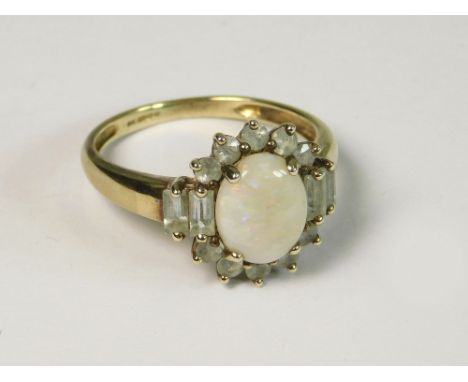 OPAL DRESS RING. A 9ct. gold opal set dress ring. Size S.