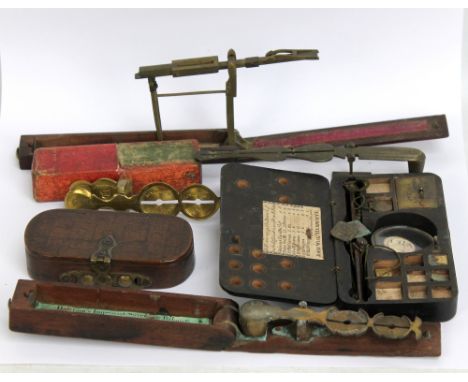 A group of brass sovereign scales to include a Harrison example, a cased I.W. Herberts London example, etc.