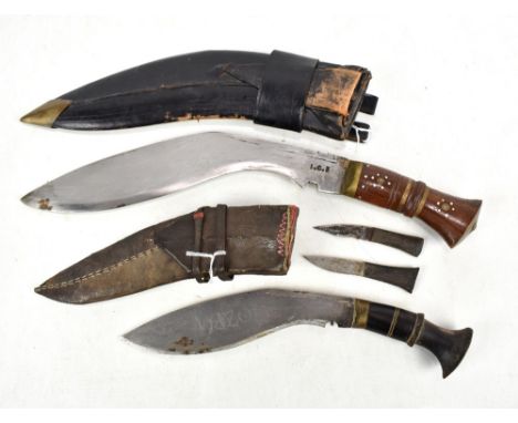 A early 20th century kukri knife in leather scabbard (lacking smaller knives), length 42cm, and a smaller example with small 