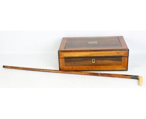 A Victorian rosewood, satin walnut banded and brass inlaid writing slope, also a walking stick with ivory handle and malacca 