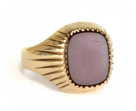 A gentleman's 9ct yellow gold signet ring set with blank carnelian, size S, approx 4.5g.Additional InformationBand misshapen.