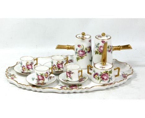 A Limoges porcelain floral and gilt decorated cabaret set stamped 'G D &amp; Cie' to bases.Additional InformationHairline cra