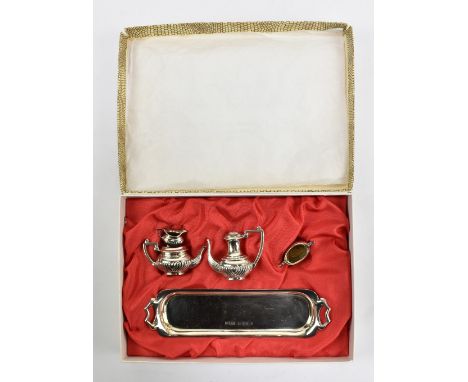 A boxed Elizabeth II hallmarked silver five-piece miniature tea service comprising tray, teapot, hot water pot, sugar bowl an