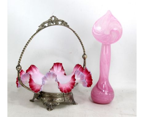 An early 20th century white opaque glass basket with crimped wavy cranberry glass rim, in electroplated frame, height 29cm, a
