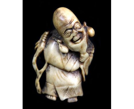 A 19th century Japanese carved stag antler netsuke of Fukurokuju, height 5.5cm.Additional InformationNatural staining commens