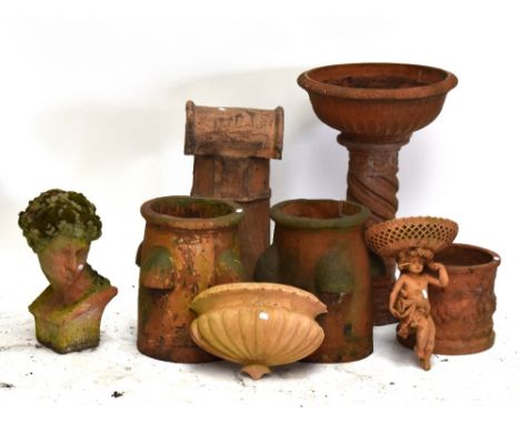 Eight pieces of reconstituted terracotta coloured garden ornamentation including two rhubarb forcers, a chimney pot, a bust, 