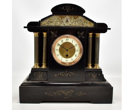 A late 19th century French black slate mantel clock with circular dial set with Arabic numerals, width 36.5cm.