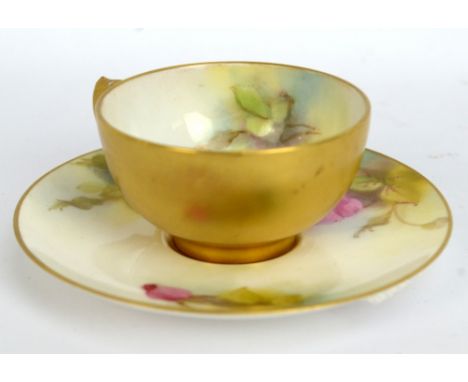 ROYAL WORCESTER;&nbsp; a floral painted cabinet cup and saucer, puce printed marks, diameter of saucer 9.5cm (af).Additional 