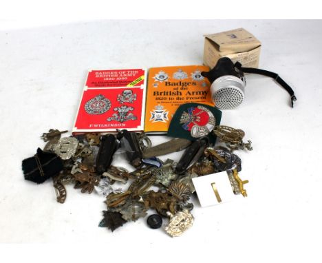 A collection of cap badges including Liverpool Scottish, Palestine Police, Army Educational Corps, Durham Light Infantry, Con