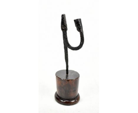 An 18th century wrought iron rush light with turned oak base, height 26cm.