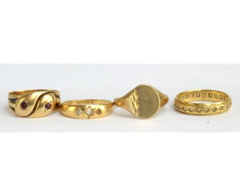 An 18ct yellow gold serpent ring (made from three rings), an 18ct yellow gold diamond set ring and an 18ct yellow gold eterni